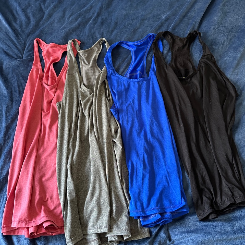 Bundle of 4 women’s exercise tank tops